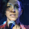 closeup of saira on stage and being asked to leave